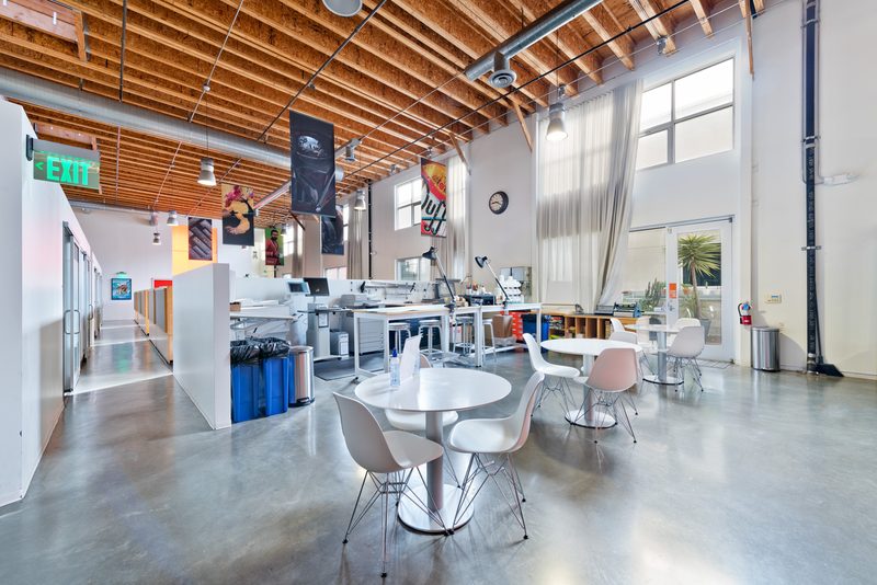 Open workspace with exposed wood-beam ceilings